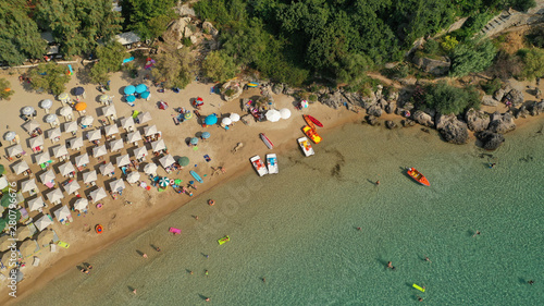 Aerial drone photo of famous organised sandy paradise beach of Kalogria in the heart of Messinian Mani next to iconic village of Stoupa, Peloponnese, Greece photo