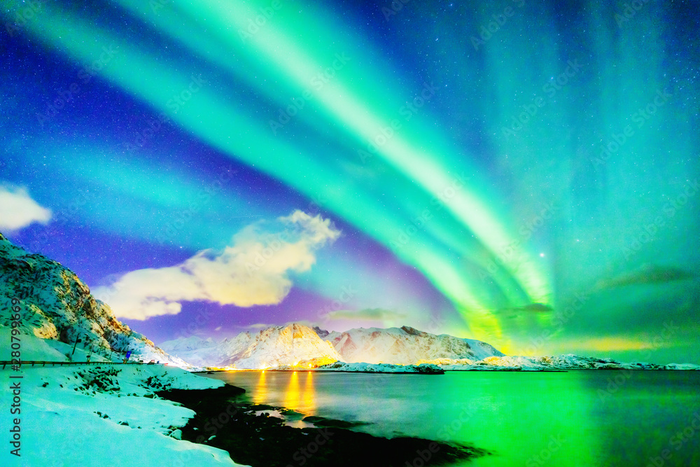 Marvelous natural wonder - Northern Lights or Aurora Borealis. Colorful night scenery of Polar Lights over Norwegian Sea on Lofoten Islands Archipelago in Norway. Winter scene  of dramatic sky. - obrazy, fototapety, plakaty 
