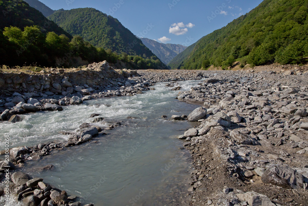 Mountain river valley landscape. Small lake made of riber stones within three months. Mountain river stream valley. River valley in mountains . stones a small river. Ismayilli Azerbaijan