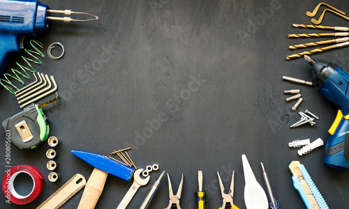hand tools and construction tools on wooden floor