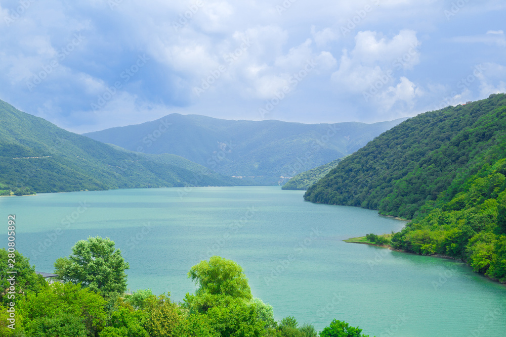 Landscape. Nature. Lake. The mountains. Green Forest. Summer. Blue sky. Clouds Beautiful top view