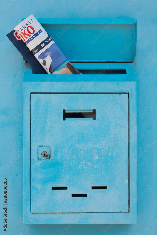 Mailbox with magazine, journal inside of it. Postal service concept. Safety of personal data background. Mail drop with newspaper, magazine. Mail doors background. Advertising concept Mailbox with magazine, journal inside of it. Postal service concept. Safety of personal data background. Mail drop with newspaper, magazine. Mail doors background. Advertising concept