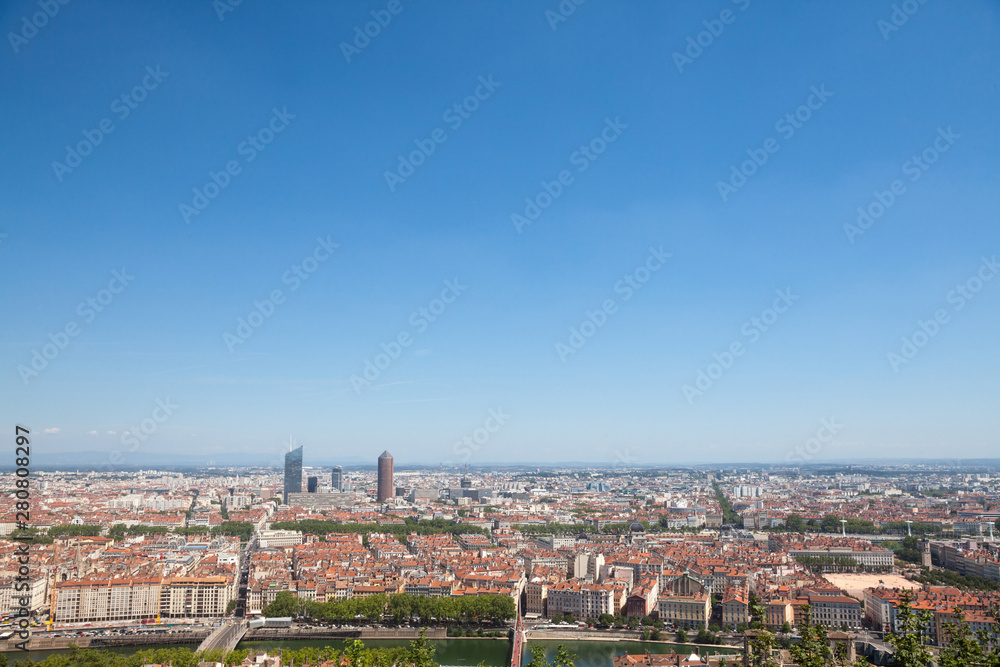 Aerial panoramic view of Lyon with the skyline of Lyon skyscrapers visible in background and Saone river in the foregroud, with the narrow streets of Old Lyon district 
