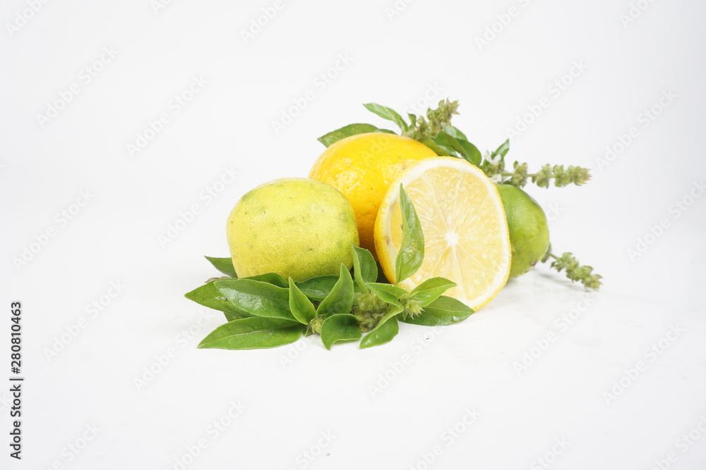 fresh lemons with green leaves