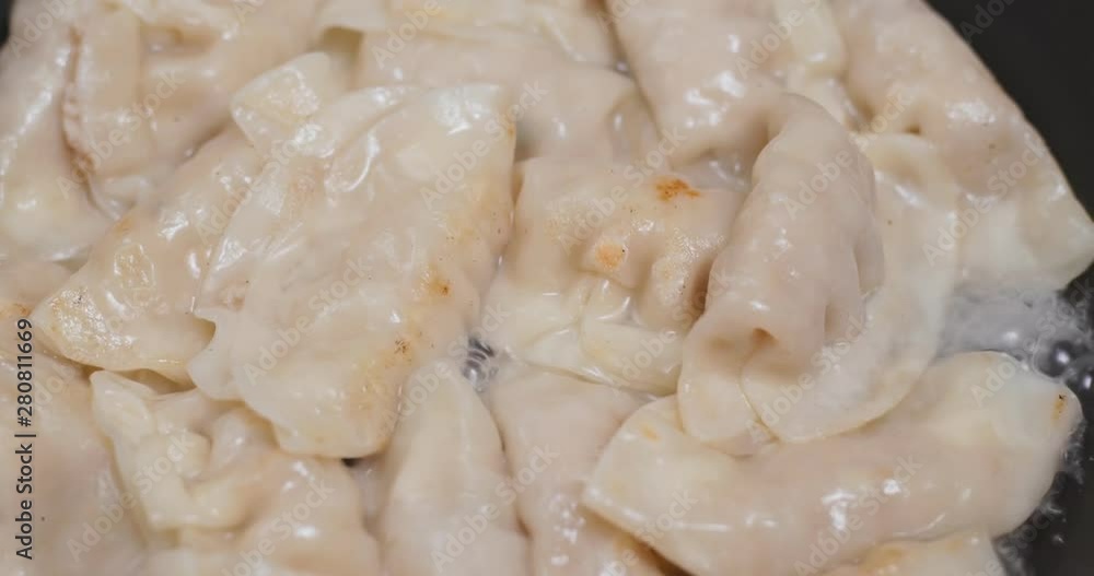 Fry meat dumpling in skillet pan Fry meat dumpling in skillet pan