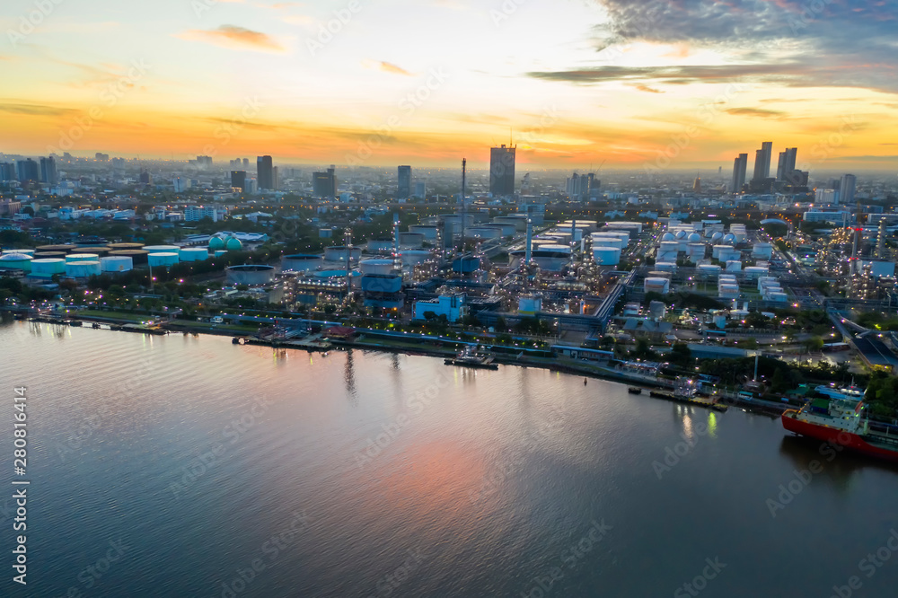 drone aerial view of refinery petrol gasoline with shipping port sunrise moment industrial ideas concept