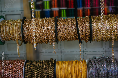 Rolls of colorful metal chains as a background photo