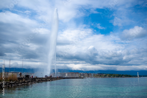 Beautiful panorama view of Geneva lake and Jet d'eau fountain on clouds sky background with copy space, Switzerland © Akara
