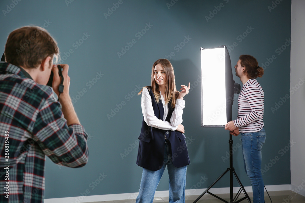 Fototapeta premium Professional photographer working with model in studio