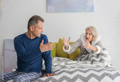Quarrelling middle-aged cou...