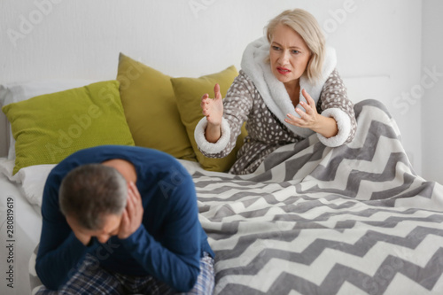 Quarrelling middle-aged cou...