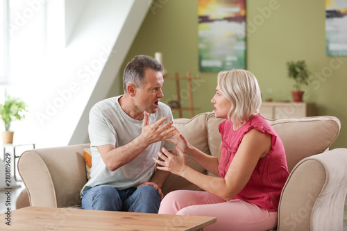 Quarrelling middle-aged cou...