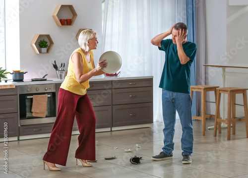 Quarrelling middle-aged cou...