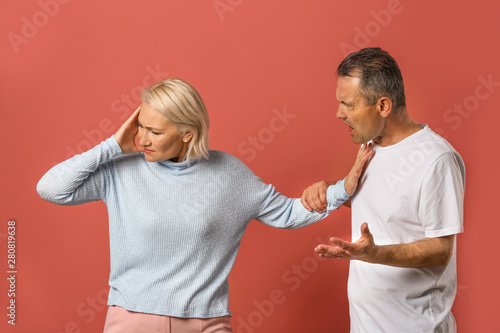 Quarrelling middle-aged cou...