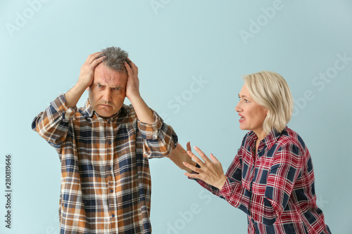 Quarrelling middle-aged cou...