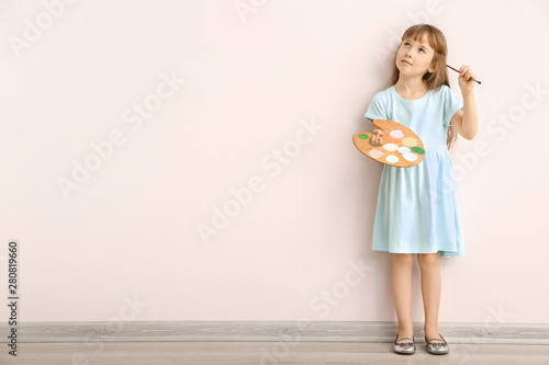 Thoughtful little girl with...