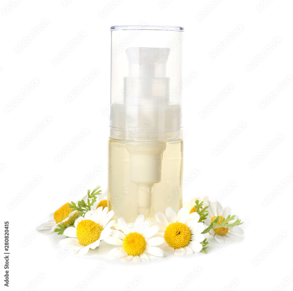 Bottle of essential oil with chamomile flowers on white background Bottle of essential oil with chamomile flowers on white background