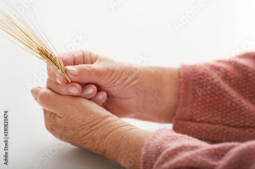 Hands of elderly woman with...