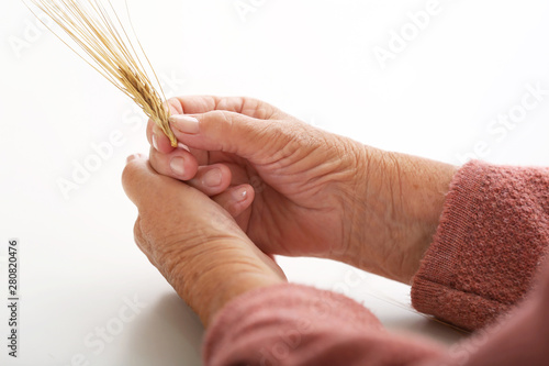 Hands of elderly woman with...