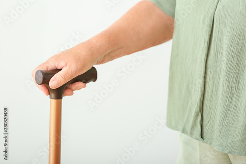 Elderly woman with walking ...