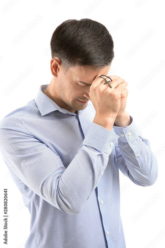 Religious man praying to God on white background Religious man praying to God on white background