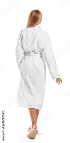 Beautiful young woman in bathrobe on white background, back view