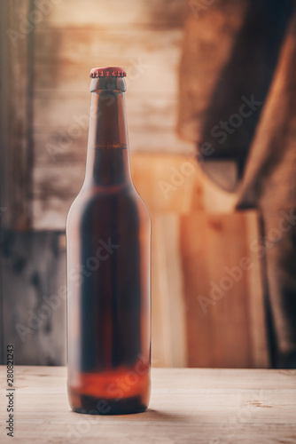 Commercial shot of a bottle of beer. Working process. Take a rest. Vertical shot. 