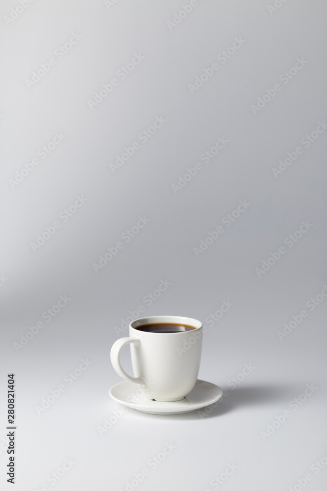 cup of coffee on bright gray background cup of coffee on bright gray background