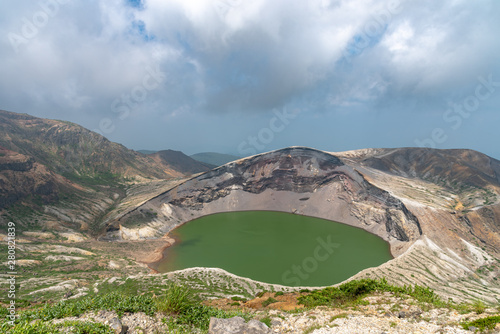 Beautiful view of Okama crater lake at Mount Zao in summer sunny day. active volcano in Miyagi Prefecture, Japan