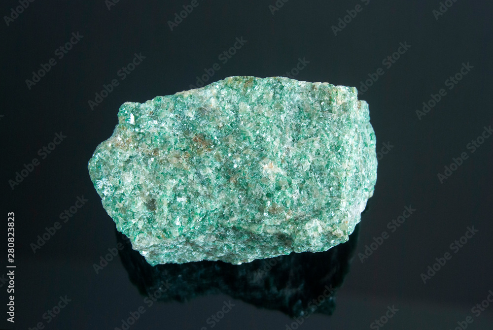 Macro shooting of natural mineral rock specimen - raw listvenite (Listwanite) stone. Origin: Russian Federation, Ural.