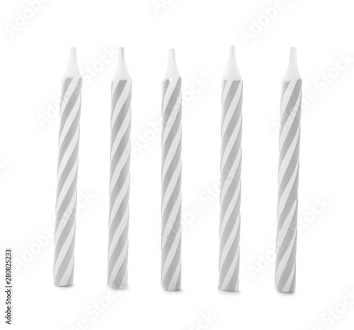 Silver striped birthday candles isolated on white