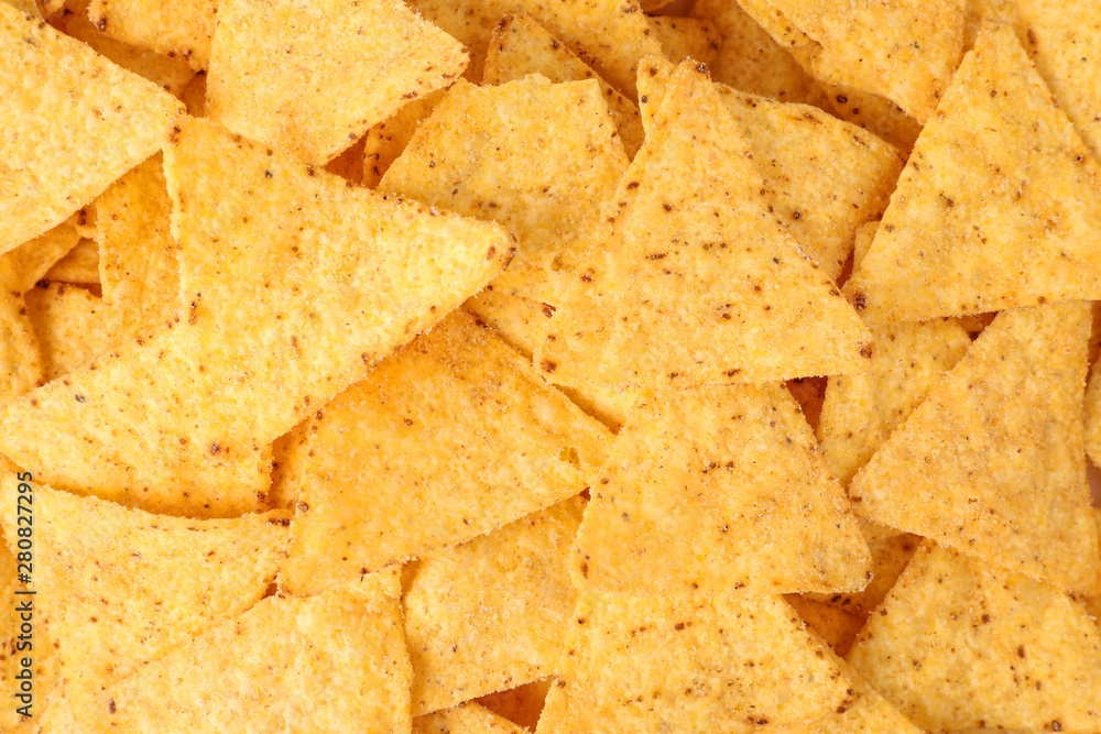 Tasty Mexican nachos chips as background, top view Tasty Mexican nachos chips as background, top view