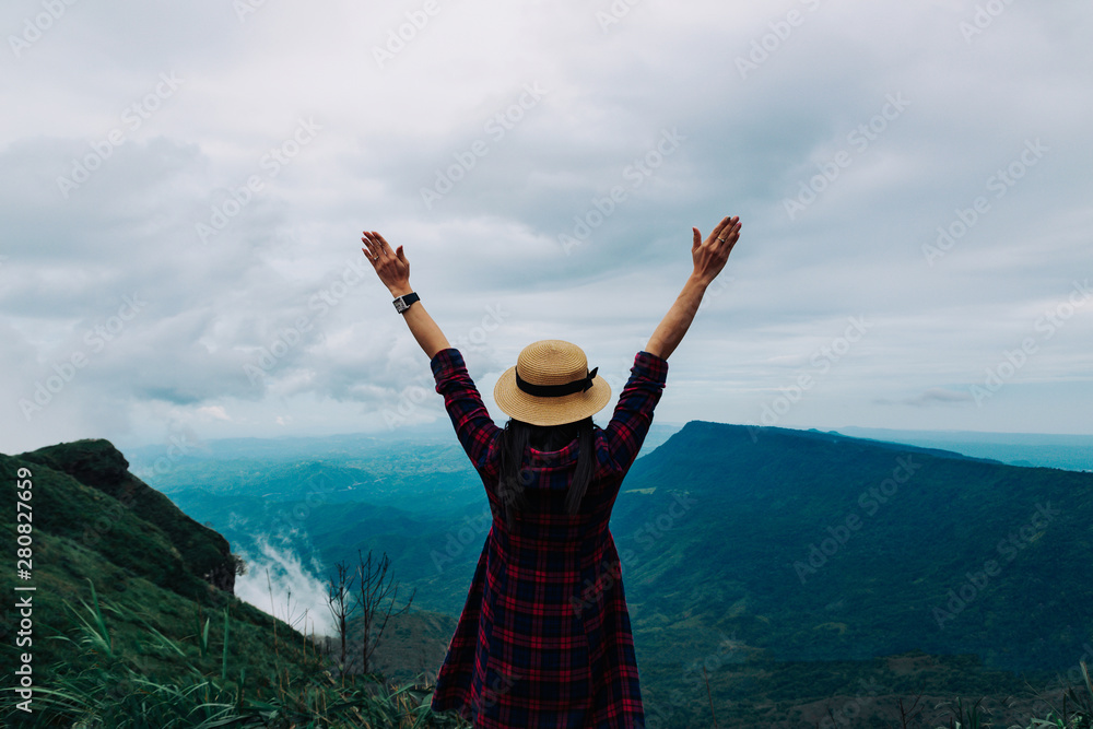 Woman travel rainy season mountain view relax in the holiday Woman travel rainy season mountain view relax in the holiday