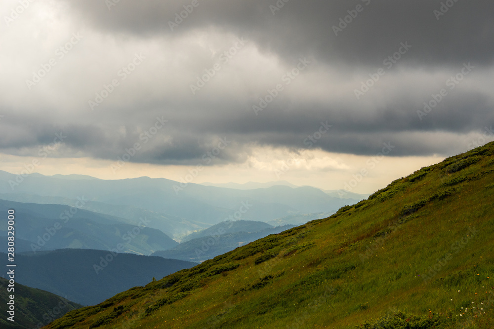 Mountain landscape. Bad weather, black clouds in the mountains. Travel journey.