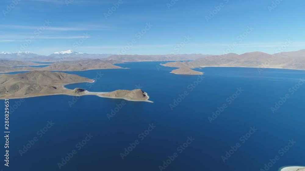 View of Yamdrok Lake (also known as Yamdrok Yumtso or Yamzho Yumco), it is a freshwater lake, one of the three largest sacred lakes in Tibet, China. View of Yamdrok Lake (also known as Yamdrok Yumtso or Yamzho Yumco), it is a freshwater lake, one of the three largest sacred lakes in Tibet, China.