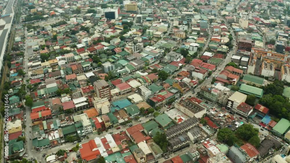 Manila city view from above with streets and buildings in the Makati business center.. Travel vacation concept. Manila city view from above with streets and buildings in the Makati business center.. Travel vacation concept.
