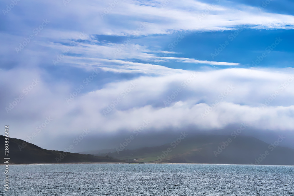 Naklejka premium A View Towards Foggy Charmouth
