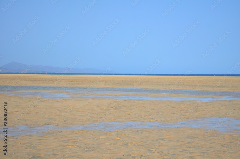 Large Fine Sand Beach of Sotavento with Low Tide in Fuerteventura Large Fine Sand Beach of Sotavento with Low Tide in Fuerteventura