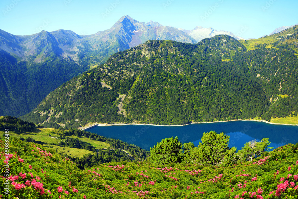 Beautiful mountain landscape with lake in French Pyrenees. Lac de l'Oule in Neouvielle national nature reserve.