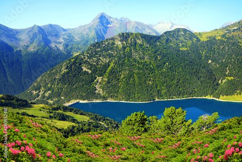 Beautiful mountain landscape with lake in French Pyrenees. Lac de l Oule in Neouvielle national nature reserve.