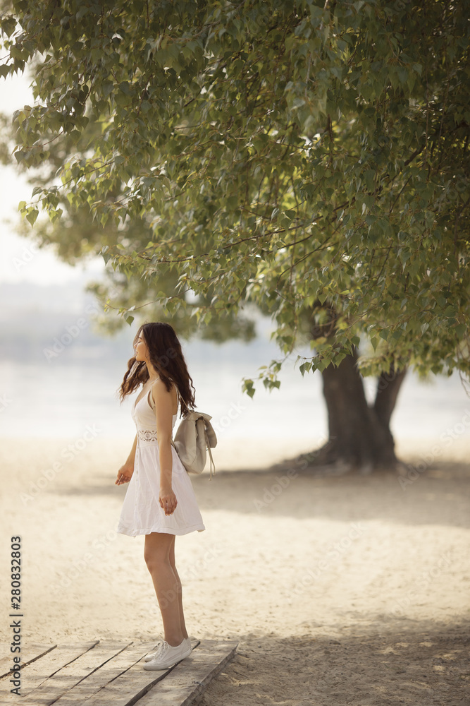 Young Woman on the Beach in Summer Young Woman on the Beach in Summer