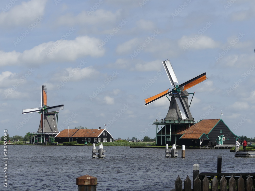  Windmills by the water. Authentic town. The old town in Holland.