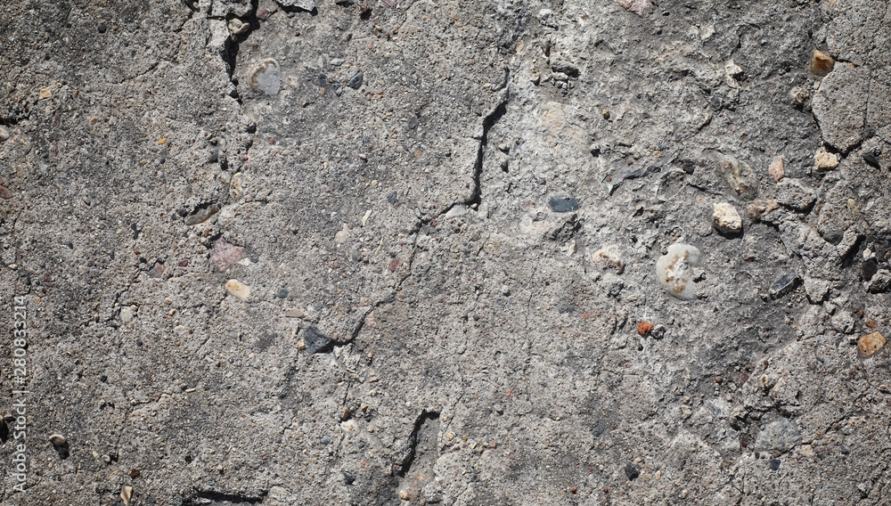 Texture of concrete. Asphalt background. Road surface. Texture of asphalt and stones on the road. Texture of concrete. Asphalt background. Road surface. Texture of asphalt and stones on the road.