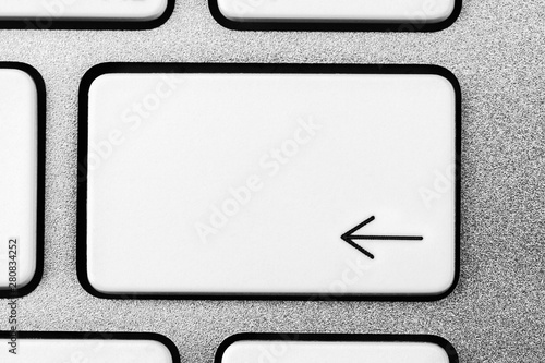 White aluminum keyboard backspace button photo