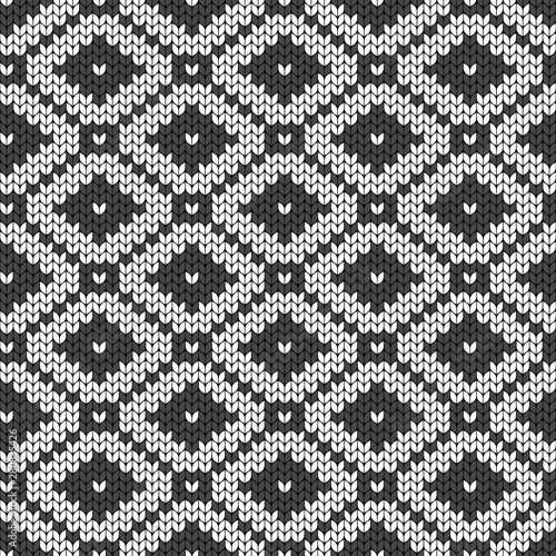 Geometric backdrop. Seamless decorative background. Knitted pattern for sweater, socks. Jacquard weave. Wallpaper.