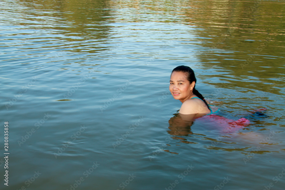  lady swimming and sunshine