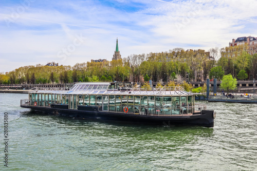 Tourist boat on the Seine river in spring. Paris, France. April 2019 photo