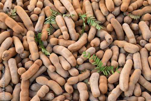 Stacked of dried tamarind fruits, Sweet tamarind for healthy photo