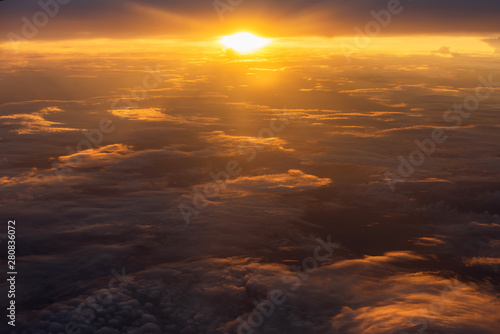 Beautiful sunlight and cloudy as seen through window of an airplane