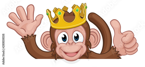 A monkey king cartoon character animal wearing a crown peeking over a sign and waving giving a thumbs up